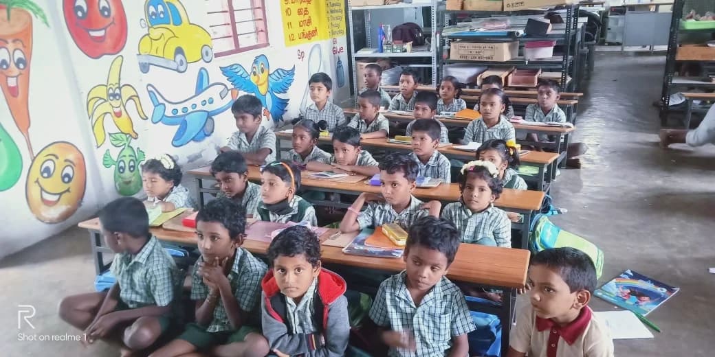 Children reading together in a Namakkal classroom